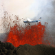 Illustration for article titled Spectacular photo of airplane flying by volcanos molten lava eruption